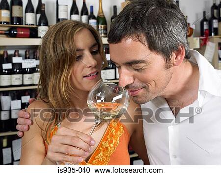 Couple smelling wine View Large Photo Image Stock Image - Couple smelling wine. Fotosearch