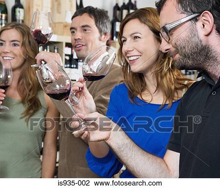 Group of friends at wine tasting View Large Photo Image Stock Image - Group of friends at wine tasting. Fotosearch