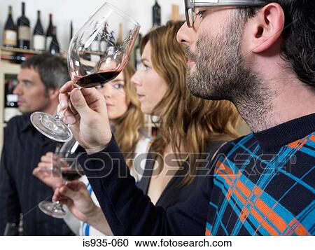 Group of friends at wine tasting View Large Photo Image Stock Image - Group of friends at wine tasting. Fotosearch