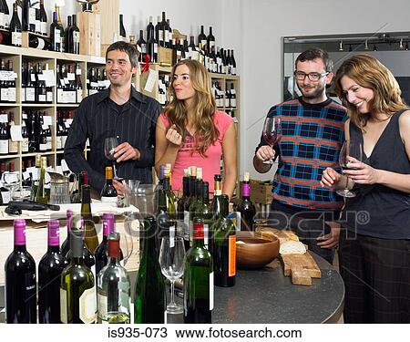 Group of friends at wine tasting View Large Photo Image Stock Image - Group of friends at wine tasting. Fotosearch