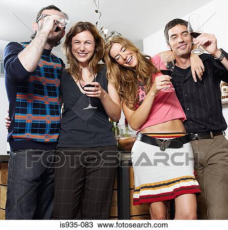 Group of friends at wine tasting View Large Photo Image Stock Image - Group of friends at wine tasting. Fotosearch