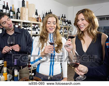 Group of friends at wine tasting View Large Photo Image Stock Image - Group of friends at wine tasting. Fotosearch
