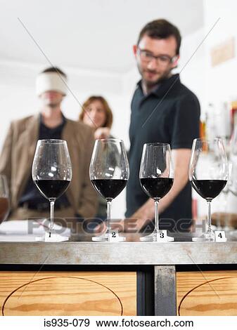 Group of friends at wine tasting View Large Photo Image Stock Photo - Group of friends at wine tasting. Fotosearch