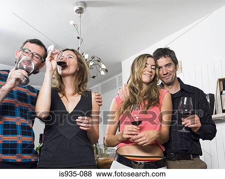 Group of friends at wine tasting View Large Photo Image Stock Photo - Group of friends at wine tasting. Fotosearch