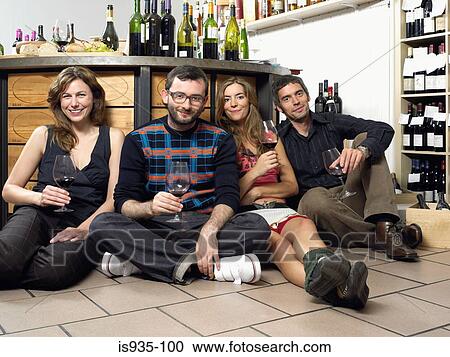 Group of friends on floor at wine tasting View Large Photo Image Stock Image - Group of friends on floor at wine tasting. Fotosearch