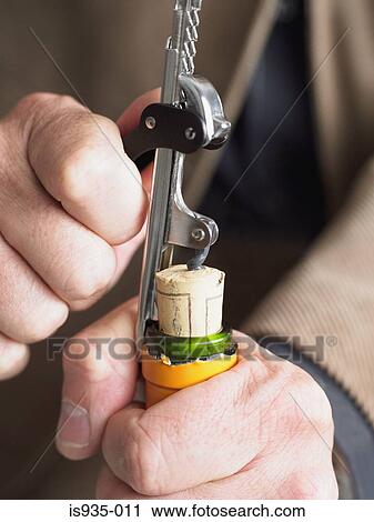 Opening wine bottle View Large Photo Image Stock Image - Opening wine bottle. Fotosearch