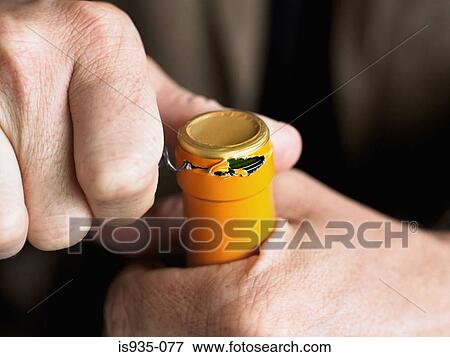 Opening wine bottle View Large Photo Image Stock Photo - Opening wine bottle. Fotosearch