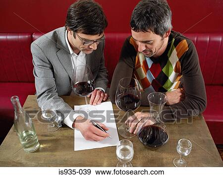 Two men at wine tasting View Large Photo Image Stock Photo - Two men at wine tasting. Fotosearch