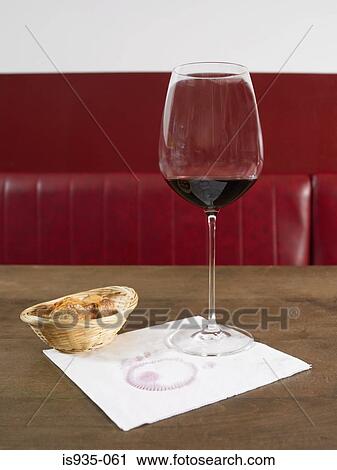 Wine glass on napkin by bread View Large Photo Image Stock Image - Wine glass on napkin by bread. Fotosearch
