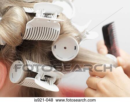 Hairdresser putting in curlers View Large Photo Image Stock Photo - Hairdresser putting in curlers. Fotosearch