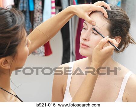 Makeup artist working on model View Large Photo Image Stock Photograph - Makeup artist working on model. Fotosearch