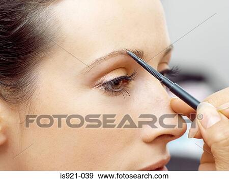 Model having eyebrow pencil applied View Large Photo Image Stock Photo - Model having eyebrow pencil applied. Fotosearch