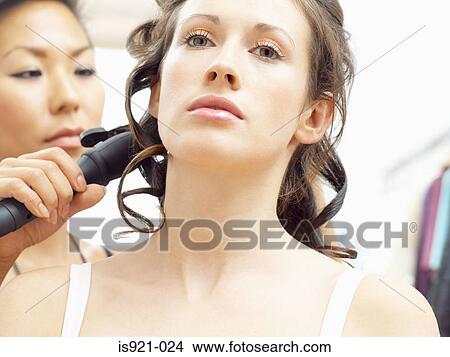 Model having her hair curled View Large Photo Image Picture - Model having her hair curled. Fotosearch