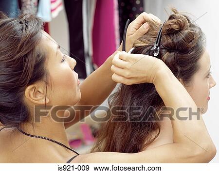 Model having her hair styled View Large Photo Image Stock Photo - Model having her hair styled. Fotosearch