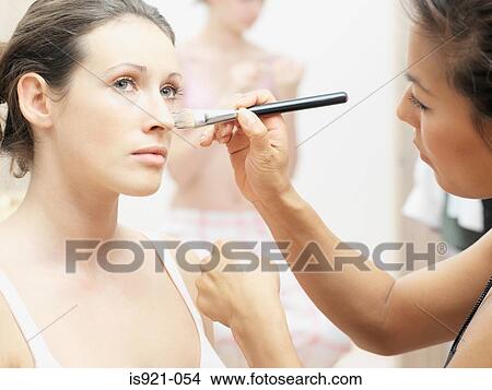 Model having make-up applied View Large Photo Image Picture - Model having make-up applied. Fotosearch