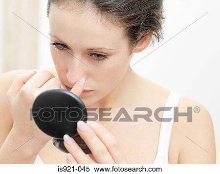 Model looking in compact mirror View Large Photo Image Stock Photography - Model looking in compact mirror. Fotosearch