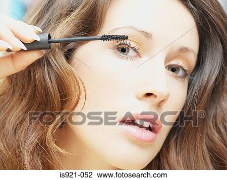Woman applying mascara View Large Photo Image Stock Image - Woman applying mascara. Fotosearch