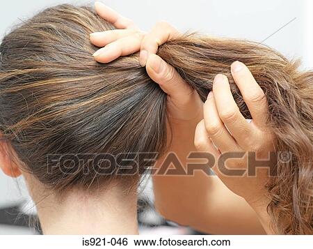 Stock Photograph - Woman having hair done. Fotosearch