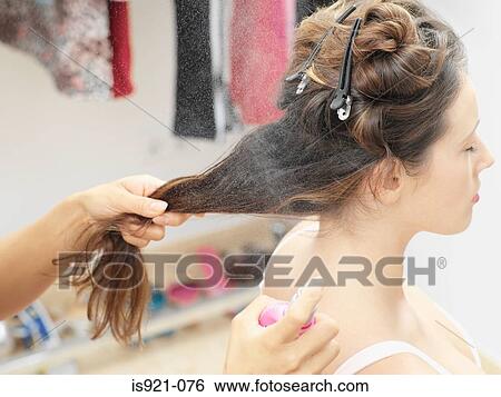 Woman having hair sprayed View Large Photo Image Stock Photograph - Woman having hair sprayed. Fotosearch