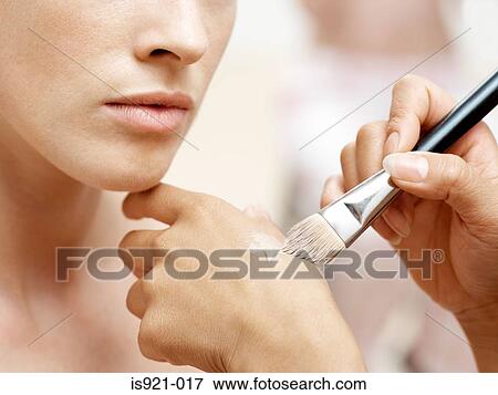 Stock Photo - Woman having make-up done. Fotosearch