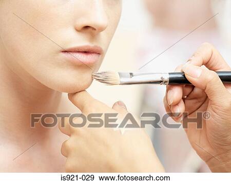 Stock Photo - Woman having make-up done. Fotosearch