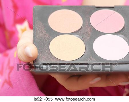 Stock Photography - Woman holding a make-up palette. Fotosearch