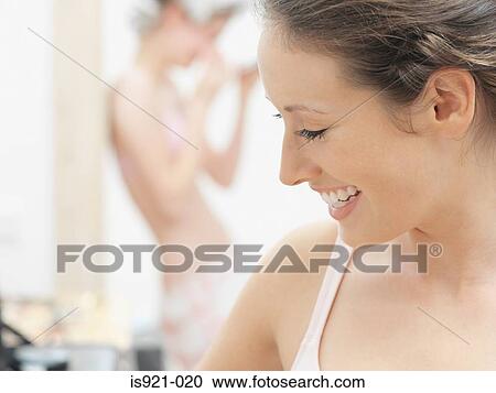 Young woman smiling View Large Photo Image Stock Image - Young woman smiling. Fotosearch