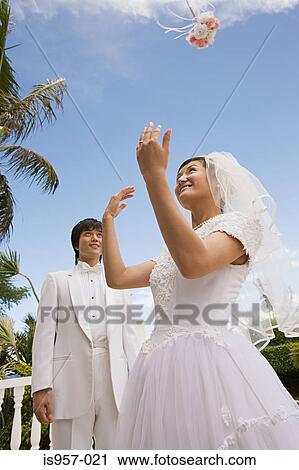 Bride throwing bouquet View Large Photo Image Stock Image - Bride throwing bouquet. Fotosearch