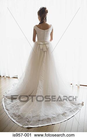Bride wearing wedding dress View Large Photo Image Stock Image - Bride wearing wedding dress. Fotosearch