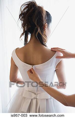 Stock Image - Bride wearing wedding dress. Fotosearch