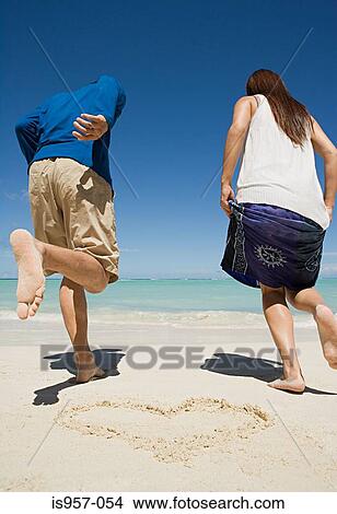 Couple on beach View Large Photo Image Picture - Couple on beach. Fotosearch