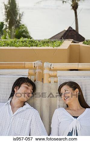 Couple relaxing View Large Photo Image Stock Photo - Couple relaxing. Fotosearch