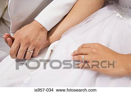 Picture - Hands of bride and groom. Fotosearch