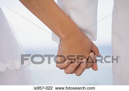 Hands of bride and groom View Large Photo Image Stock Image - Hands of bride and groom. Fotosearch