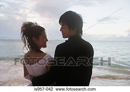 Newlyweds on beach View Large Photo Image Stock Image - Newlyweds on beach . Fotosearch