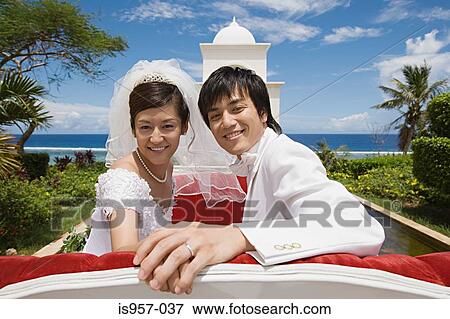Stock Photo - Newlyweds on horsedrawn carriage. Fotosearch