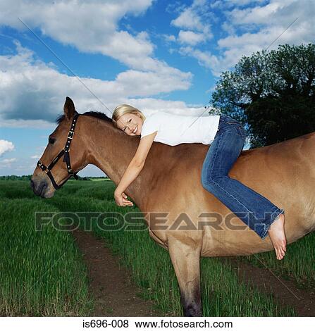 Smiling woman on horse View Large Photo Image Stock Photo - Smiling woman on horse. Fotosearch