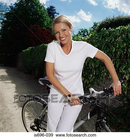 Woman with bicycle on path View Large Photo Image Stock Photo - Woman with bicycle on path. Fotosearch