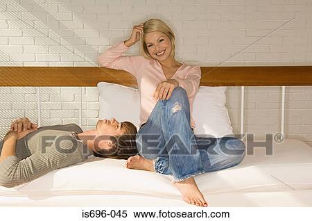 Young couple on sofa View Large Photo Image Stock Photography - Young couple on sofa. Fotosearch