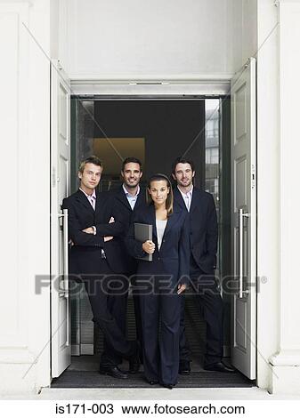 Businesspeople in a doorway View Large Photo Image Stock Image - Businesspeople in a doorway. Fotosearch