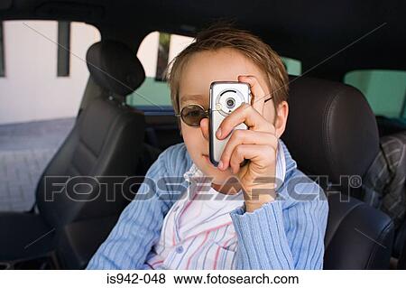 Boy with camera phone View Large Photo Image Stock Photo - Boy with camera phone. Fotosearch
