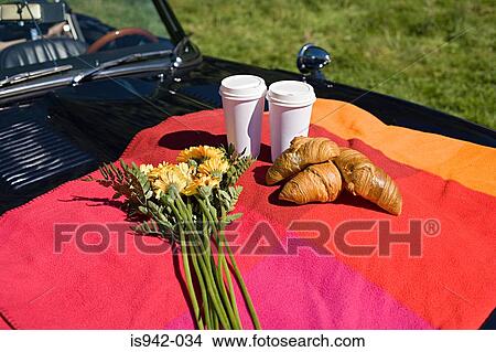 Picture - Breakfast and flowers on bonnet. Fotosearch