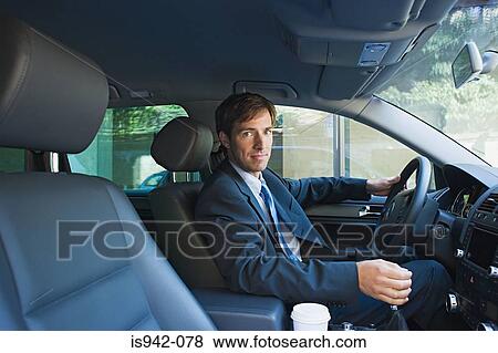 Businessman driving car View Large Photo Image Stock Photo - Businessman driving car. Fotosearch