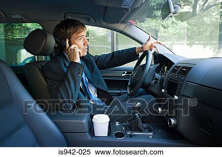 Businessman on cell phone in car View Large Photo Image Stock Photography - Businessman on cell phone in car. Fotosearch
