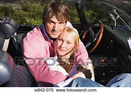 Couple in a convertible View Large Photo Image Stock Image - Couple in a convertible. Fotosearch