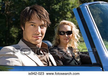 Couple in convertible View Large Photo Image Stock Image - Couple in convertible. Fotosearch
