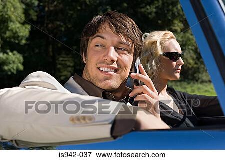 Couple in convertible View Large Photo Image Stock Photo - Couple in convertible. Fotosearch