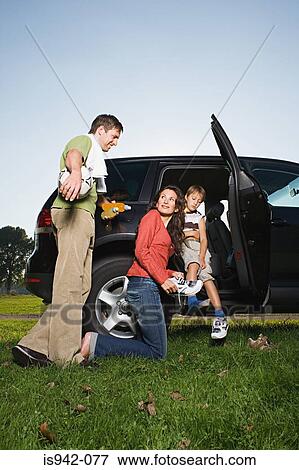 Family getting out of car View Large Photo Image Stock Photo - Family getting out of car. Fotosearch