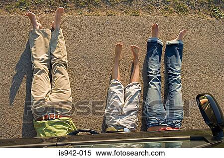 Family under car View Large Photo Image Stock Photography - Family under car. Fotosearch