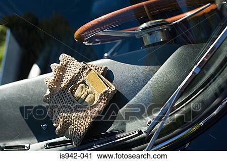 Stock Image - Gloves on dashboard. Fotosearch